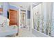 Clean bathroom with blue walls, a vintage sink, and floral shower curtain at 350 E Park Ave, Lake Wales, FL 33853