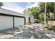 Two car garage with additional parking and mature trees at 350 E Park Ave, Lake Wales, FL 33853