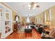 Bright and airy living room with hardwood floors, large windows, and comfortable seating at 350 E Park Ave, Lake Wales, FL 33853