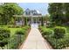 Charming two-story home with a spacious front porch and landscaped yard at 350 E Park Ave, Lake Wales, FL 33853