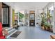 Inviting screened porch with ample seating and potted plants at 350 E Park Ave, Lake Wales, FL 33853
