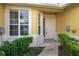Inviting front entrance with landscaping and a white door at 3017 Mission Lakes Dr, Lakeland, FL 33803