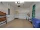 Clean and organized garage with extra storage space and interior access door at 3017 Mission Lakes Dr, Lakeland, FL 33803