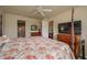 Bright bedroom with a large bed, dresser, and access to a bathroom at 3017 Mission Lakes Dr, Lakeland, FL 33803