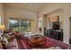 Living area with comfortable furniture, large TV, and access to patio at 3017 Mission Lakes Dr, Lakeland, FL 33803
