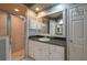 Elegant bathroom with granite countertops, a large mirror, and a walk-in shower at 3017 Mission Lakes Dr, Lakeland, FL 33803