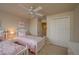 Bright bedroom featuring twin beds, ample closet space, and an adjoining hallway at 3017 Mission Lakes Dr, Lakeland, FL 33803