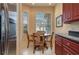 Kitchen features a breakfast nook, dark wood cabinets, and granite countertops at 3017 Mission Lakes Dr, Lakeland, FL 33803
