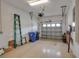 Spacious garage with overhead storage, providing ample room for vehicles and storage at 3017 Mission Lakes Dr, Lakeland, FL 33803