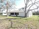 House backyard with large trees and grass at 5016 Washington St, Lake Wales, FL 33859