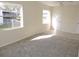 Bedroom with grey carpet, window, and exterior view at 5016 Washington St, Lake Wales, FL 33859