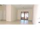 Dining room with tile floors and French doors to patio at 5016 Washington St, Lake Wales, FL 33859