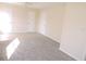 Living room with grey carpet and tile flooring at 5016 Washington St, Lake Wales, FL 33859