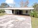 White single story home with carport at 5016 Washington St, Lake Wales, FL 33859
