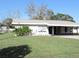 White single story home with carport at 5016 Washington St, Lake Wales, FL 33859