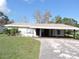 White single story home with carport at 5016 Washington St, Lake Wales, FL 33859