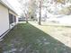 House backyard with grass and trees at 5016 Washington St, Lake Wales, FL 33859