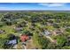 Wide aerial view of neighborhood featuring several homes and lush greenery at 40 Britton St, Babson Park, FL 33827