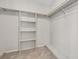 Walk in closet with shelving and hanging rods at 40 Britton St, Babson Park, FL 33827