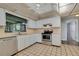 Kitchen with stainless steel appliances and white cabinets at 40 Britton St, Babson Park, FL 33827