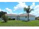 Ranch-style home with a palm tree in the front yard at 914 Oxford Way, Lake Wales, FL 33853