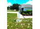 Landscaped front yard with a light post at 914 Oxford Way, Lake Wales, FL 33853