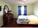 Spacious bedroom with a dresser and a ceiling fan at 914 Oxford Way, Lake Wales, FL 33853