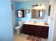 Clean bathroom with a vanity, toilet, and shower at 914 Oxford Way, Lake Wales, FL 33853