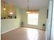 Dining area with tiled floors, window, and light fixture at 914 Oxford Way, Lake Wales, FL 33853