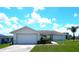 Single-story home with attached garage and landscaped lawn at 914 Oxford Way, Lake Wales, FL 33853