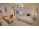 Main bedroom with king-size bed, ceiling fan, and access to patio at 8203 Village Dr # 8203, Lake Wales, FL 33898