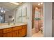 Bathroom with wood vanity, shower/tub combo, and updated fixtures at 8203 Village Dr # 8203, Lake Wales, FL 33898