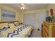 Bedroom with king-size bed, ceiling fan, and large closet at 8203 Village Dr # 8203, Lake Wales, FL 33898