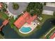 An aerial view of a community pool and patio area at 8203 Village Dr # 8203, Lake Wales, FL 33898