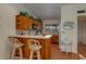 Galley kitchen with wood cabinets, microwave, oven, and refrigerator at 8203 Village Dr # 8203, Lake Wales, FL 33898