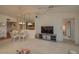 Casual dining area with round table and chairs, adjacent to kitchen at 8203 Village Dr # 8203, Lake Wales, FL 33898