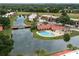 Aerial view of community pool, spa, and lake at 8203 Village Dr # 8203, Lake Wales, FL 33898