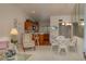 Open concept kitchen and dining area with wood cabinets and a breakfast bar at 8203 Village Dr # 8203, Lake Wales, FL 33898