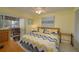 Bedroom with king-size bed, ceiling fan, and access to balcony at 8203 Village Dr # 8203, Lake Wales, FL 33898