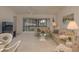 Spacious living room with comfortable furniture and access to a lanai at 8203 Village Dr # 8203, Lake Wales, FL 33898