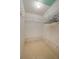 Spacious walk-in closet with wire shelving and hanging rods at 8203 Village Dr # 8203, Lake Wales, FL 33898