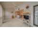 Bright Florida room with ceiling fan, TV stand, and access to outdoor patio at 8203 Village Dr # 8203, Lake Wales, FL 33898