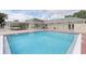 Community swimming pool with ample deck space at 231 Lake Suzanne Dr, Lake Wales, FL 33859