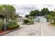 Gated community entrance with landscaping and security features at 231 Lake Suzanne Dr, Lake Wales, FL 33859