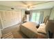 Comfortable bedroom featuring a queen bed, ample closet space, and sliding doors at 220 La Casa # 220, Lake Wales, FL 33898