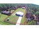 Aerial view of a house with a large fenced yard and detached shed at 117 Lake Caloosa Lndg, Frostproof, FL 33843