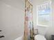 Simple bathroom with shower/tub combo and floral shower curtain at 341 Lake Suzanne Dr, Lake Wales, FL 33859