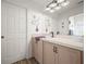 Clean bathroom with light wood cabinets and a large vanity at 341 Lake Suzanne Dr, Lake Wales, FL 33859