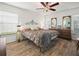 Main bedroom with king-size bed and wood flooring at 341 Lake Suzanne Dr, Lake Wales, FL 33859