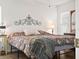 Bedroom with king-size bed and decorative wall art at 341 Lake Suzanne Dr, Lake Wales, FL 33859